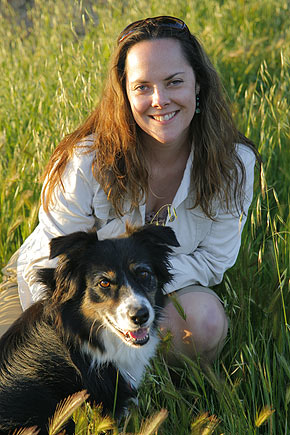 Winemaker Alison Crowe with her dog outside in a vineyard